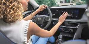 lady sitting in a Buick controlling the ac